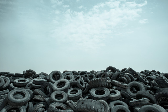 Old tires field cloudy sky free wallpaper for desktop - medium preview image