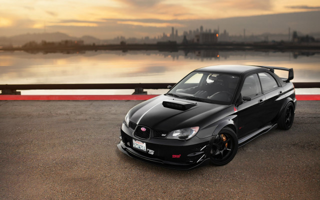 Black car water city sunset free wallpaper for desktop - medium preview image