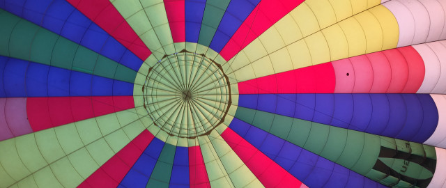 Colorful hot air balloon person free wallpaper for desktop - medium preview image