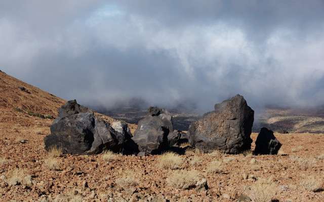 Rocky hill cloudy sky drygrass free wallpaper for desktop - medium preview image