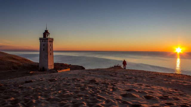 Lighthouse beach sunset person tilt free wallpaper for desktop - medium preview image