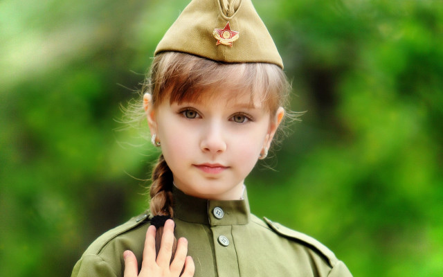 Little girl uniform smiling green free wallpaper for desktop - medium preview image