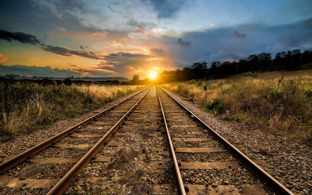 Train track sunset field mountains free wallpaper for desktop - medium preview image
