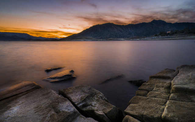 Sunset lake rocks mountains clouds free wallpaper for desktop - medium preview image
