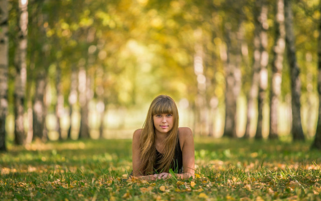 Woman forest ground leaves bokeh free wallpaper for desktop - medium preview image