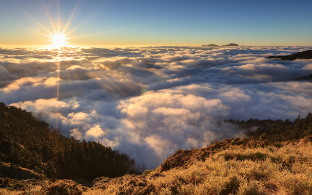 Mountain sun clouds grassy horizon free wallpaper for desktop - medium preview image