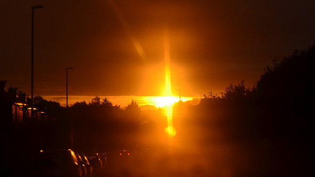 Bright sunset orange sky cityscape free wallpaper for desktop - medium preview image