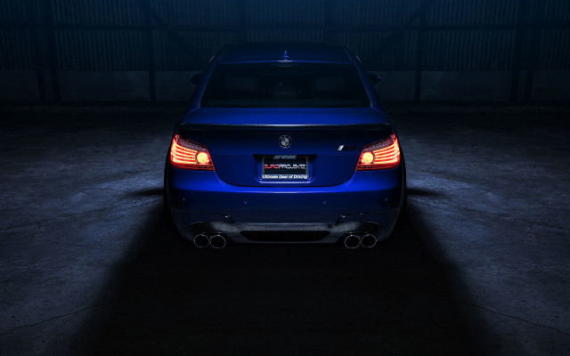 Blue car dark garage illuminated free wallpaper for desktop - medium preview image