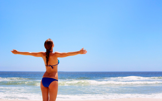Woman beach bikini outstretched arms #2 free wallpaper for desktop - medium preview image
