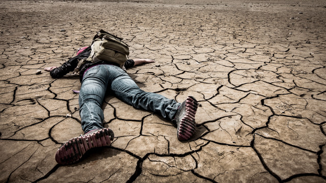 Person laying backpack desert brick free wallpaper for desktop - medium preview image
