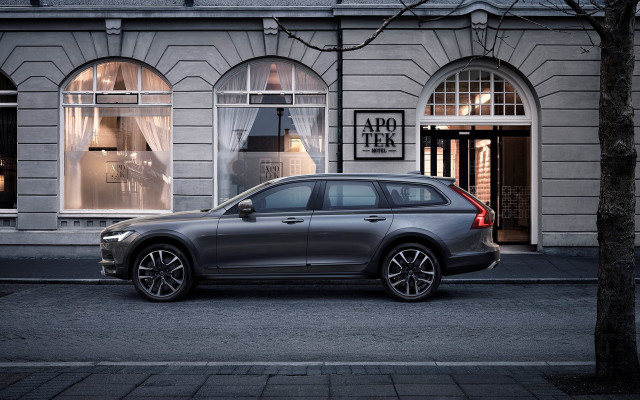 Volvo city street night storefront free wallpaper for desktop - medium preview image