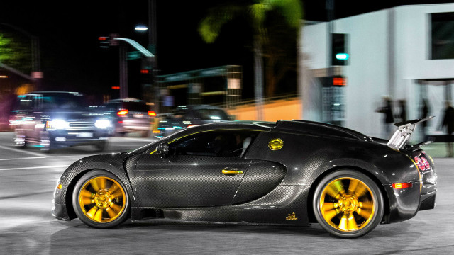 Black sports car yellow wheels free wallpaper for desktop - medium preview image