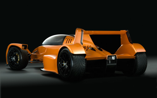Orange race car dark room #2 free wallpaper for desktop - medium preview image