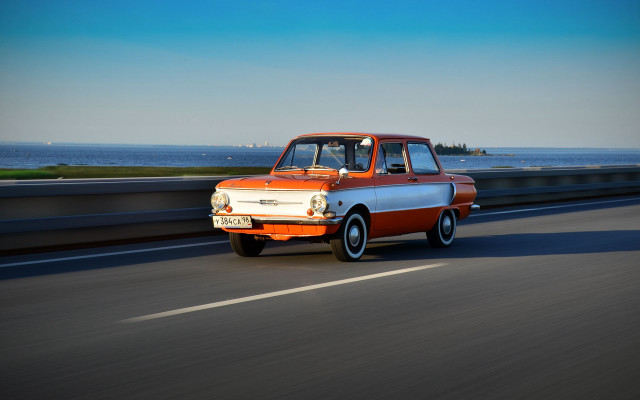 Orange white truck ocean road free wallpaper for desktop - medium preview image
