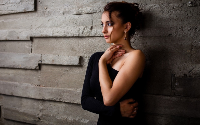 Woman leaning wall serious portrait #4 free wallpaper for desktop - medium preview image