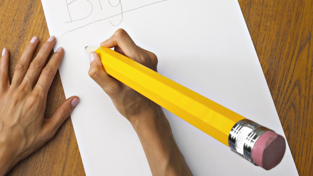 Person writing pencil yellow paper free wallpaper for desktop - medium preview image