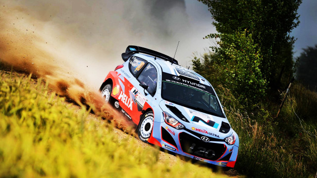 Rally car dirt road woods free wallpaper for desktop - medium preview image