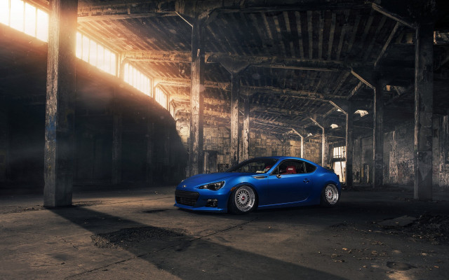 Blue sports car building sunlight free wallpaper for desktop - medium preview image
