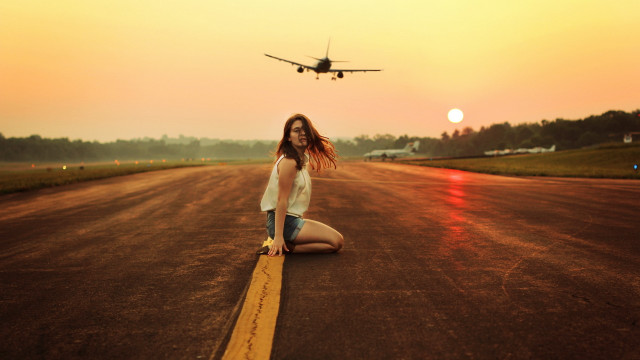 Woman sitting plane beach sunset free wallpaper for desktop - medium preview image