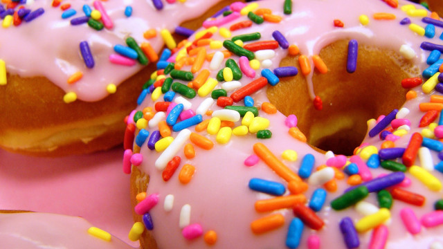 Doughnut sprinkles pink background hyperrealism free wallpaper for desktop - medium preview image