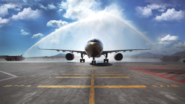 Jet water spray airport clouds free wallpaper for desktop - medium preview image