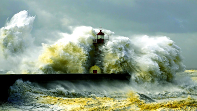 Lighthouse wave stormy ocean impressionist free wallpaper for desktop - medium preview image