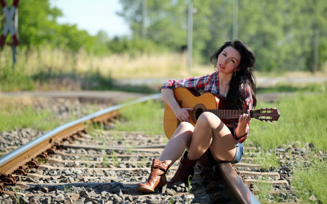 Woman sitting train track guitar free wallpaper for desktop - medium preview image