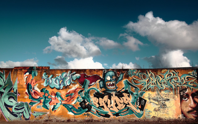 Graffiti wall cloudy sky mountains free wallpaper for desktop - medium preview image