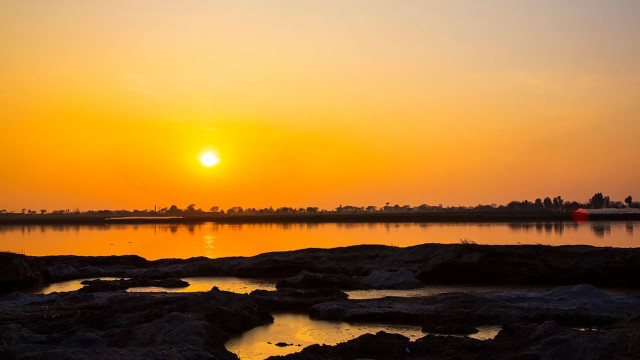 Sunset water rocks boat buoy free wallpaper for desktop - medium preview image