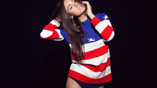 Woman flag sweater dark background free wallpaper for desktop - medium preview image