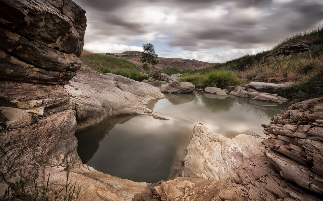 Small pool rocky area cloudy free wallpaper for desktop - medium preview image