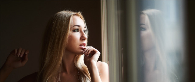 Blonde woman window posing portrait free wallpaper for desktop - medium preview image