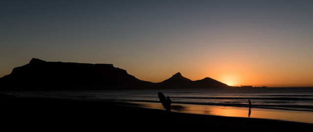 Beach sunset surfboard mountain portrait free wallpaper for desktop - medium preview image