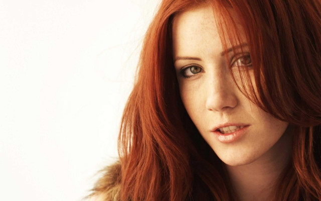 Redhair woman furcoat serious look free wallpaper for desktop - medium preview image