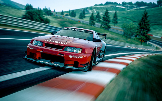 Red car racing green hill free wallpaper for desktop - medium preview image