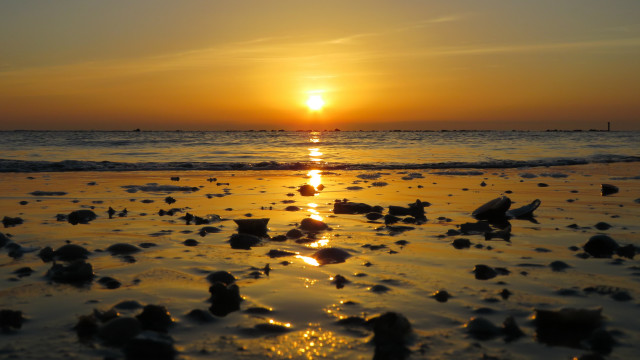 Sunset ocean beach rocks boat free wallpaper for desktop - medium preview image
