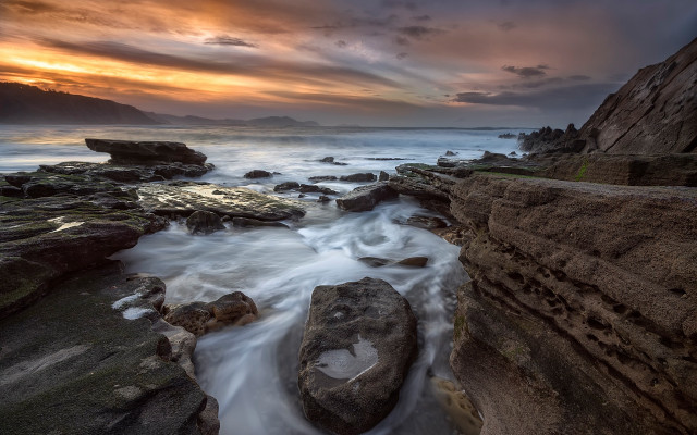 Rocky beach sunset clouds ocean free wallpaper for desktop - medium preview image