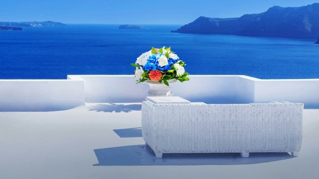 Vase flowers couch ocean mountains free wallpaper for desktop - medium preview image