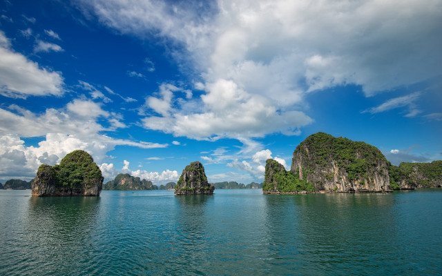 Rocky island reflection clouds sky free wallpaper for desktop - medium preview image