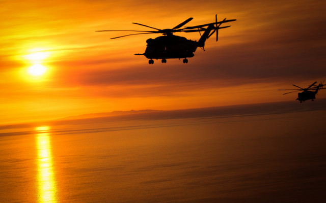 Helicopter over ocean sunset orange free wallpaper for desktop - medium preview image
