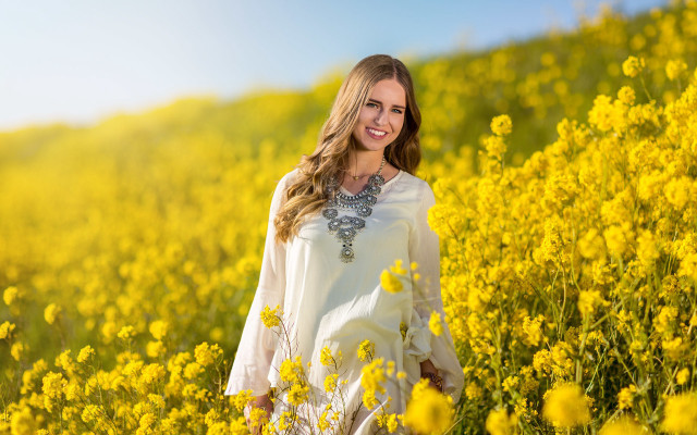 Woman field yellowflowers smiling autumn #2 free wallpaper for desktop - medium preview image