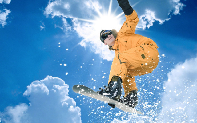 Snowboarder orange jacket trick blue free wallpaper for desktop - medium preview image