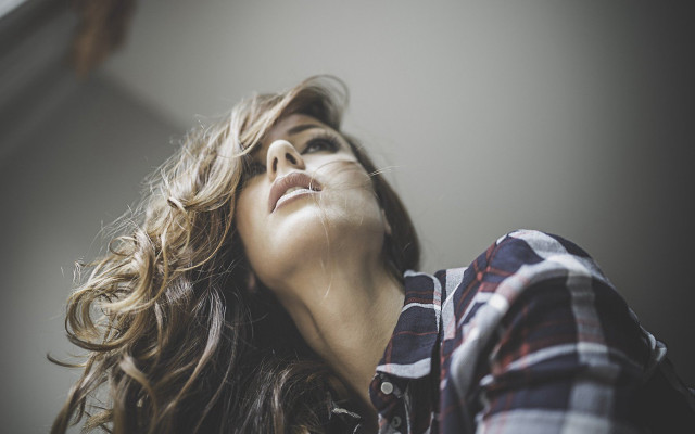 Woman blowing hair eyes closed free wallpaper for desktop - medium preview image