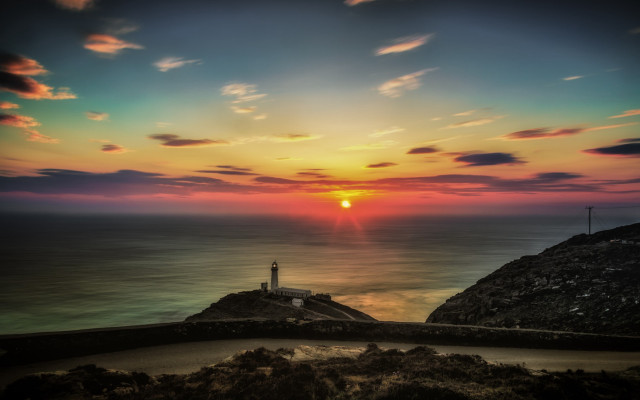 Lighthouse cliff ocean sunset colorful free wallpaper for desktop - medium preview image