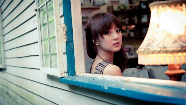 Woman window lamp building portrait free wallpaper for desktop - medium preview image