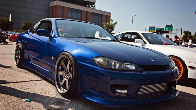 Blue car white car parking free wallpaper for desktop - medium preview image