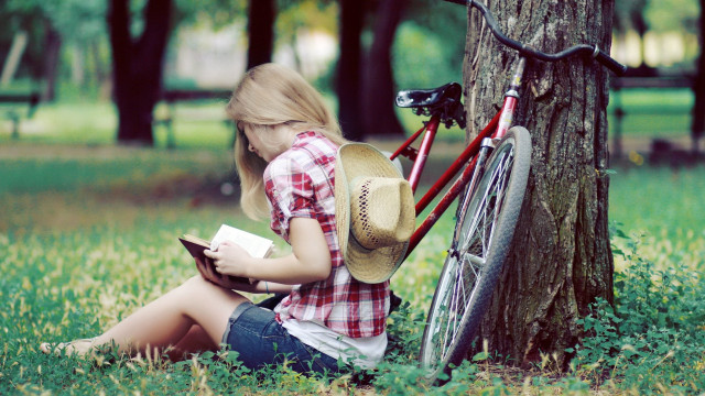 Girl bicycle reading tree grass free wallpaper for desktop - medium preview image