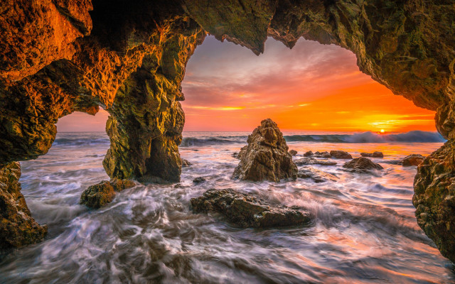 Sunset rocky beach cave ocean free wallpaper for desktop - medium preview image
