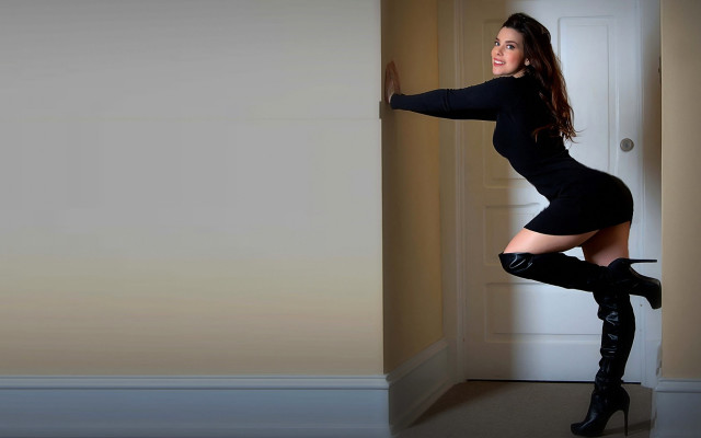 Woman black dress heels leaning free wallpaper for desktop - medium preview image