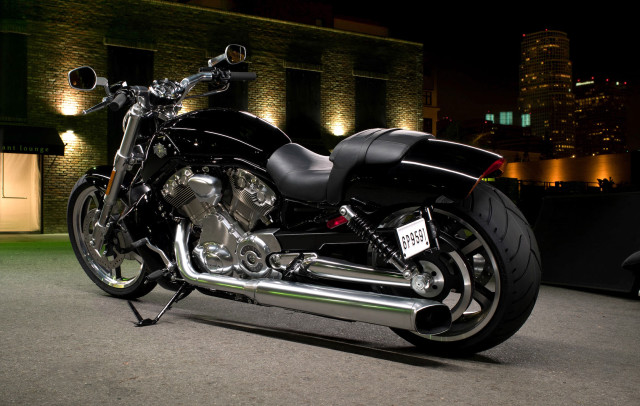 Black motorcycle night building lights free wallpaper for desktop - medium preview image